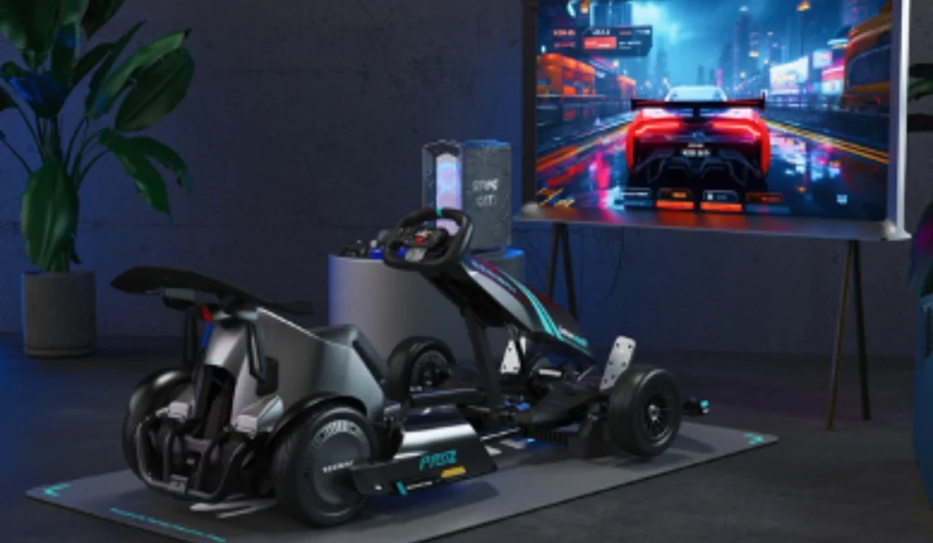 Vehículo eléctrico Segway Ninebot Gokart PRO 2 conectado como simulador de videojuegos frente a una pantalla de carreras.